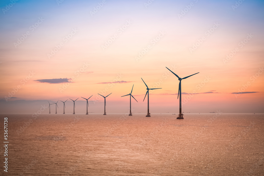 Naklejka premium offshore wind farm at dusk