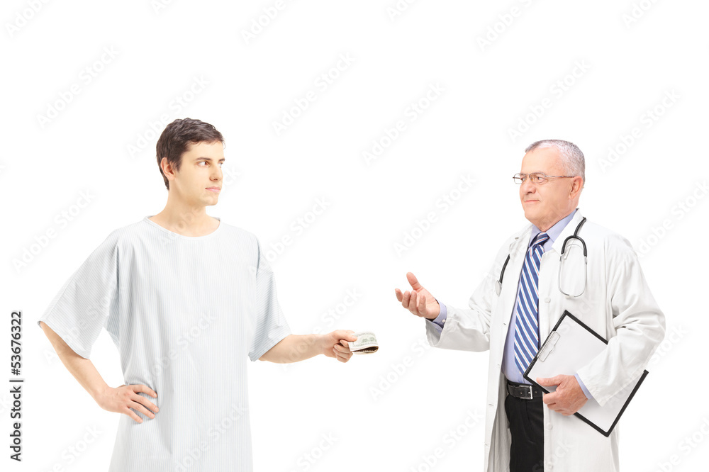 Male patient in hospital gown offering bribe to a medical doctor Male patient in hospital gown offering bribe to a medical doctor