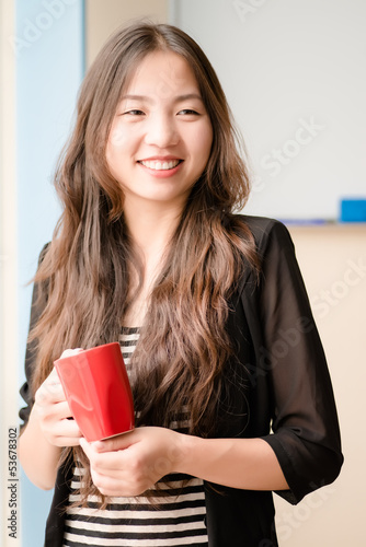 young girl with a cup