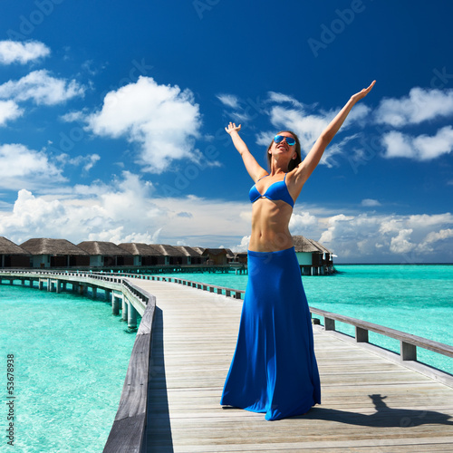 Woman on a beach jetty at Maldives © haveseen