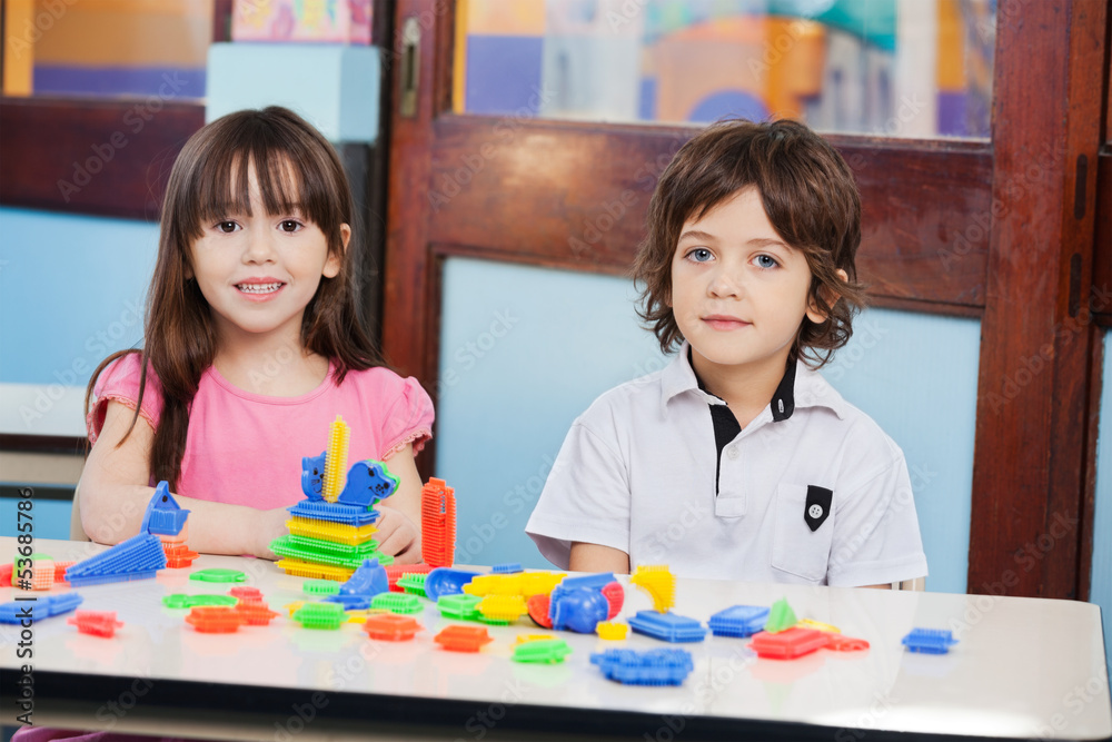 Cute Friends With Construction Blocks In Kindergarten Cute Friends With Construction Blocks In Kindergarten
