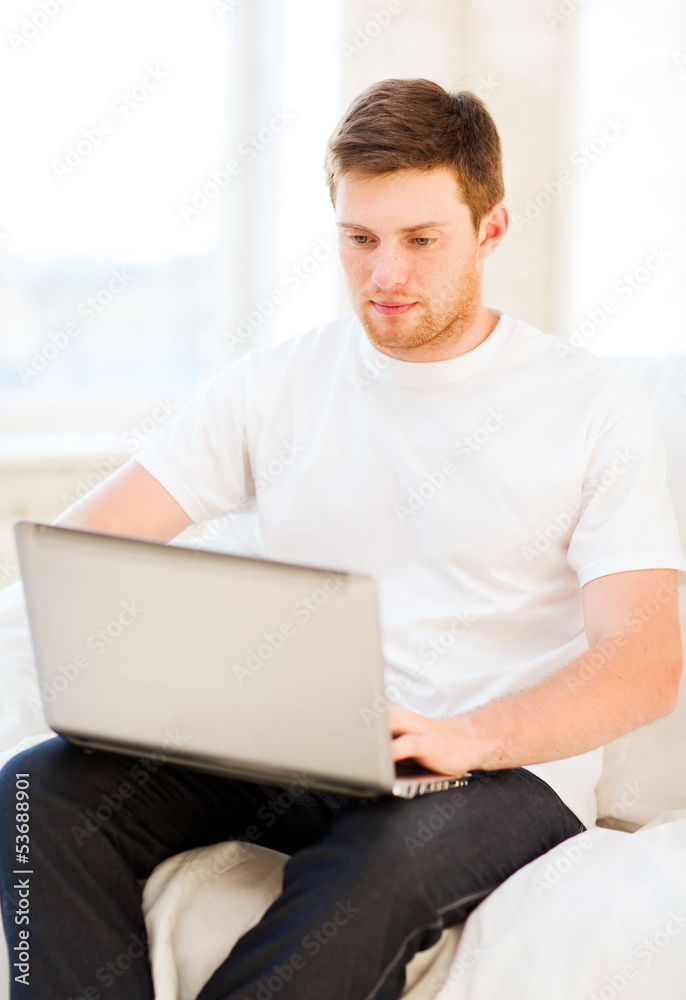man working with laptop at home