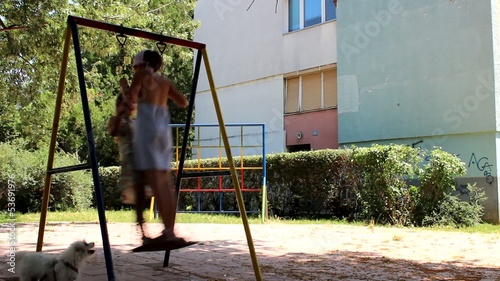 Two girls,one swing photo