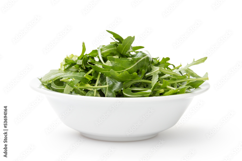 fresh rucola leaves in a bowl