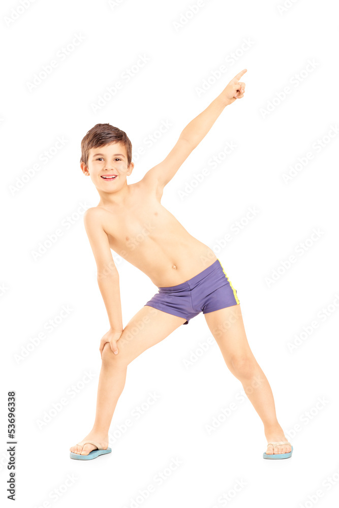 Obraz premium Full length portrait of a boy in swimming shorts gesturing with