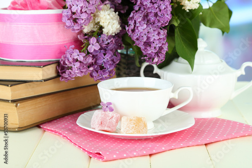 Fototapeta Naklejka Na Ścianę i Meble -  Composition with beautiful lilac flowers, tea service