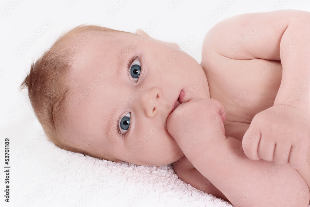 Cute baby gnaws a finger, teething. A sweet child. Cute baby gnaws a finger, teething. A sweet child.