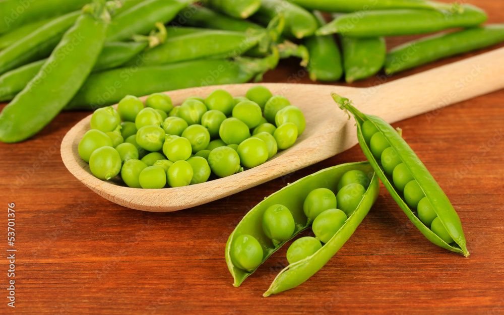 Sweet green peas on wooden background Sweet green peas on wooden background