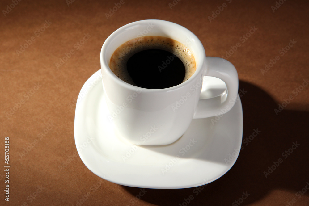 Cup of coffee on brown background Cup of coffee on brown background