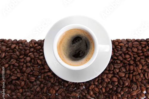 Cup of coffee with coffee beans, isolated on white