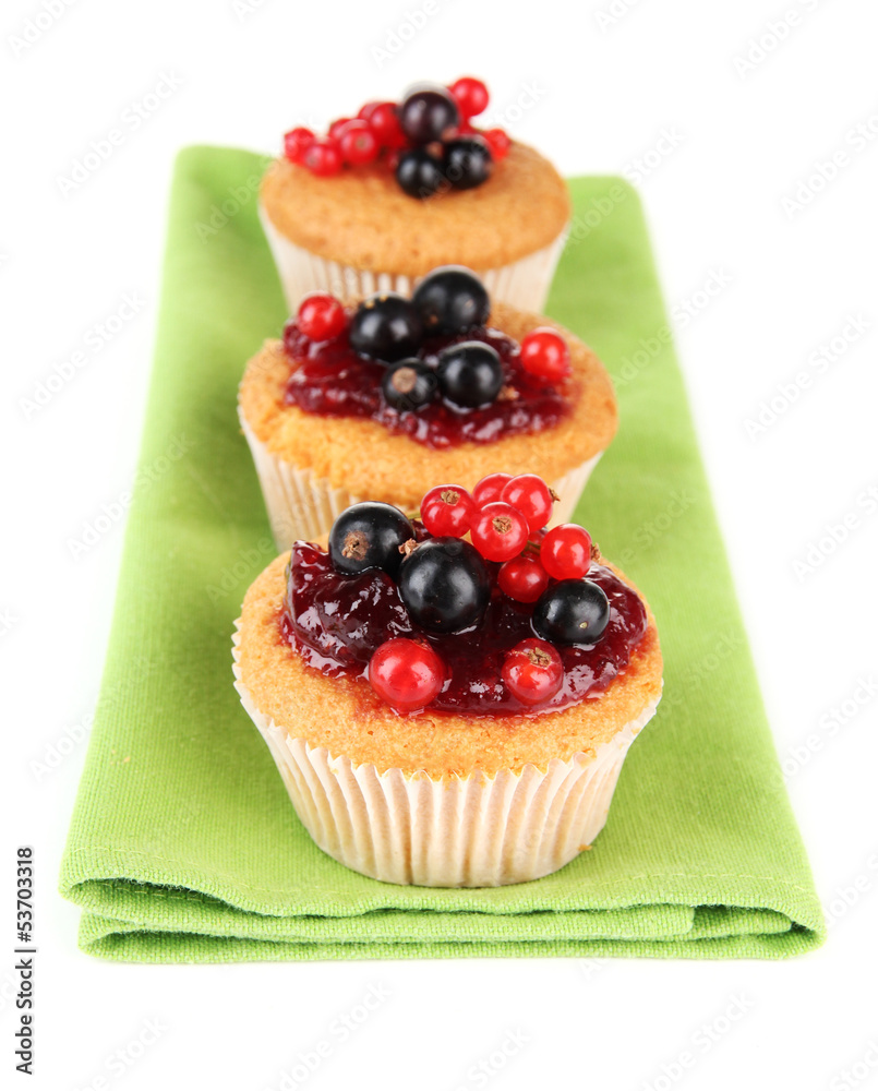 Tasty muffins with berries isolated on white Tasty muffins with berries isolated on white