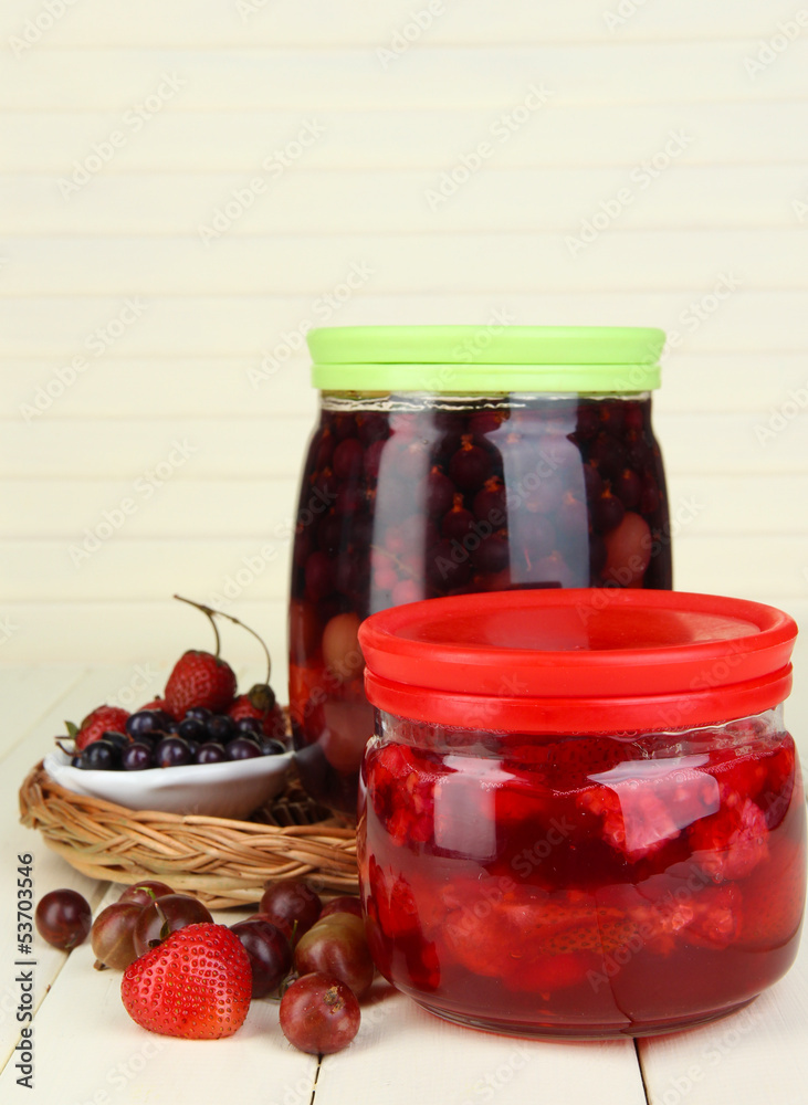 Home made berry jam on wooden table Home made berry jam on wooden table