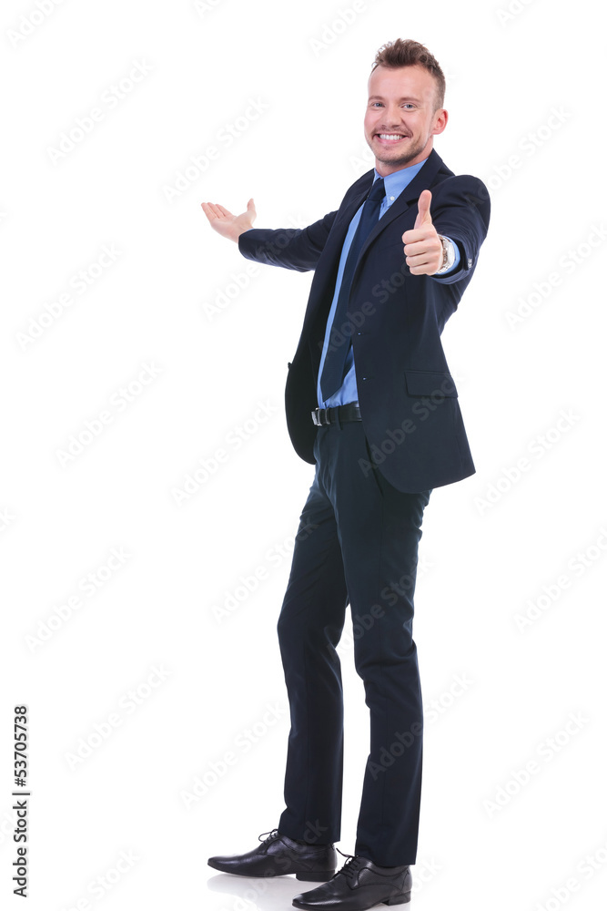 business man presents something and shows ok business man presents something and shows ok