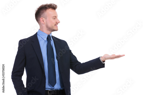 business man looks at his opened palm
