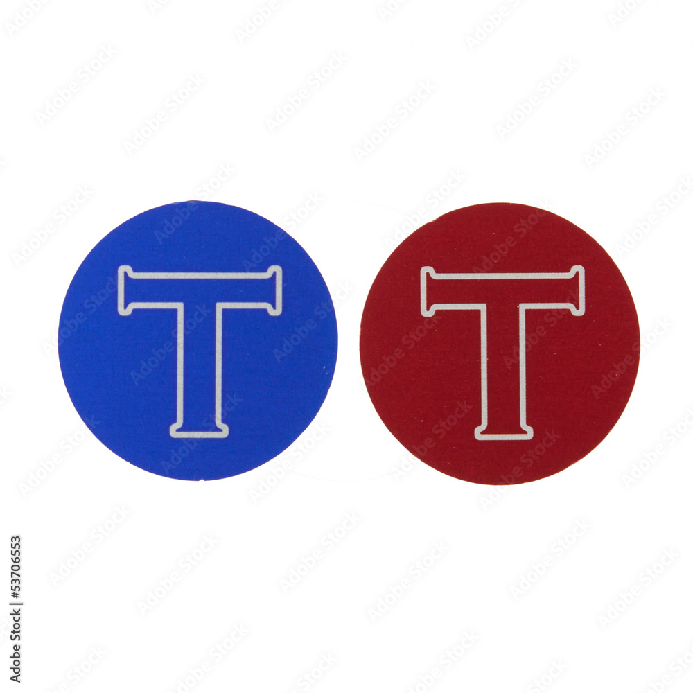 Blue and red coin with the letter T Blue and red coin with the letter T