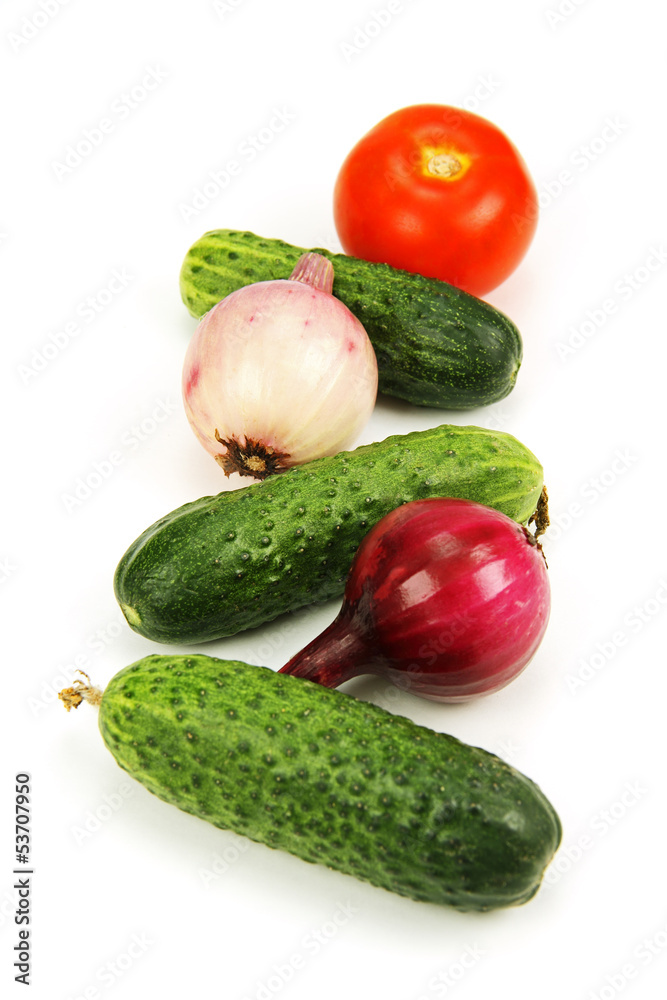 green cucumber, red tomato and young onions. green cucumber, red tomato and young onions.