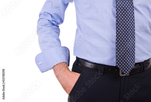 Businessman with hand in pocket.