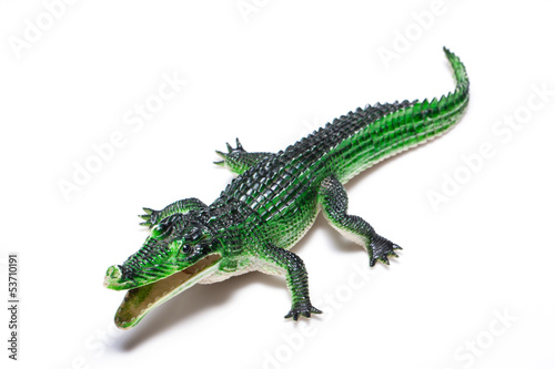 Crocodile toy on white background © japhoto