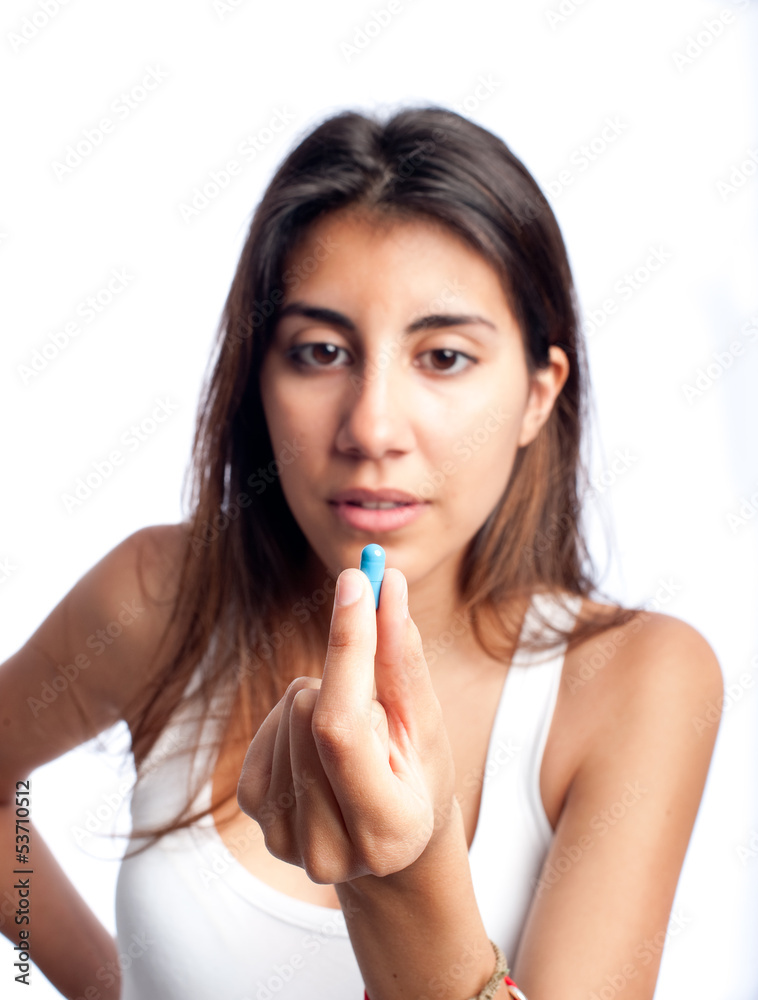 young woman holding a pill young woman holding a pill