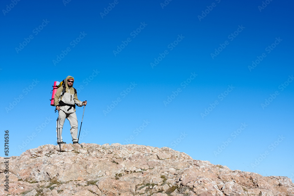 Hiker is standing on top of mountain in Crimea mountains against