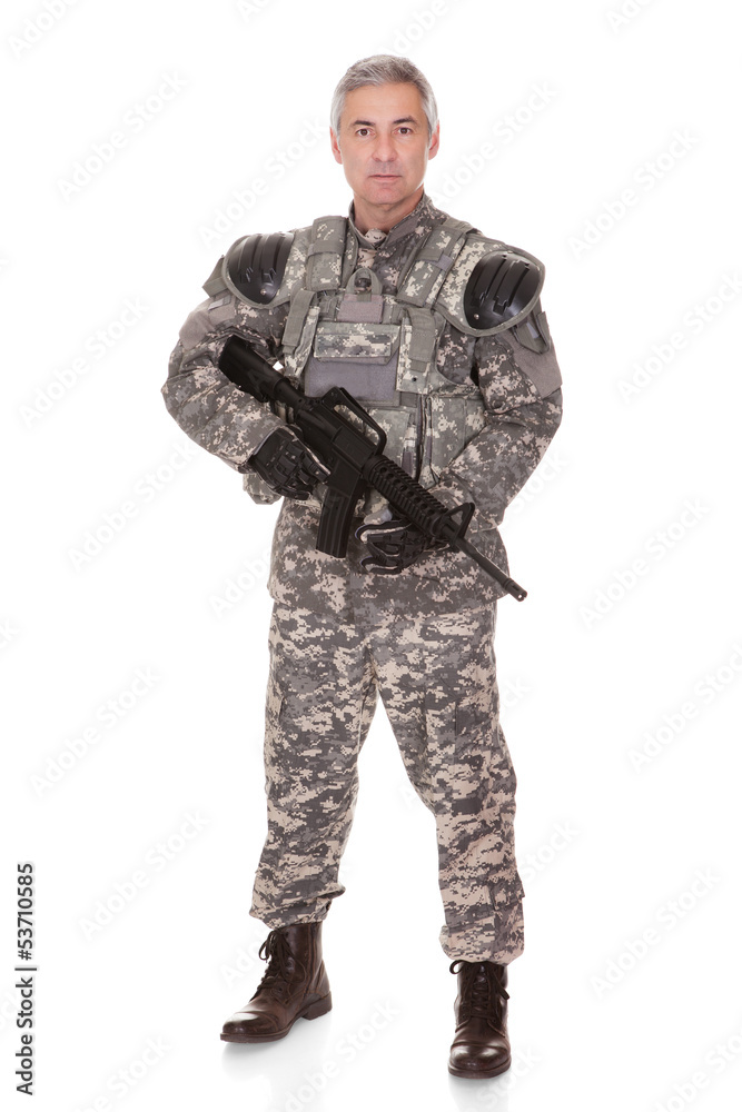 Mature Soldier Holding Rifle
