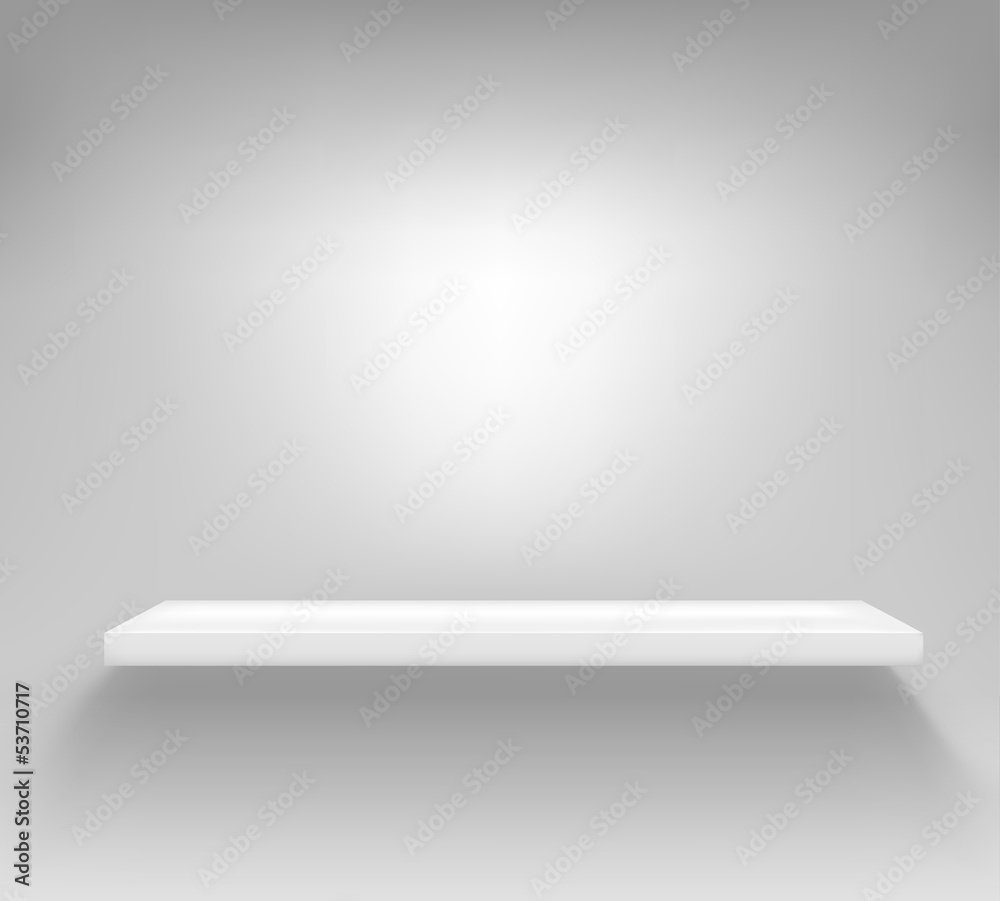 Empty white shelf hanging on a wall Empty white shelf hanging on a wall