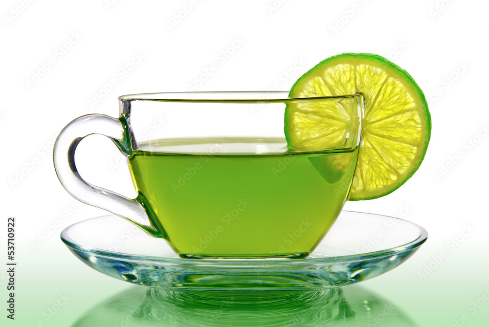 Green tea with lemon on a white background. Green tea with lemon on a white background.