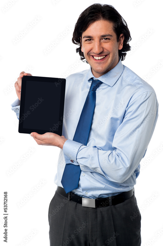 Sales manager displaying newly launched tablet pc Sales manager displaying newly launched tablet pc