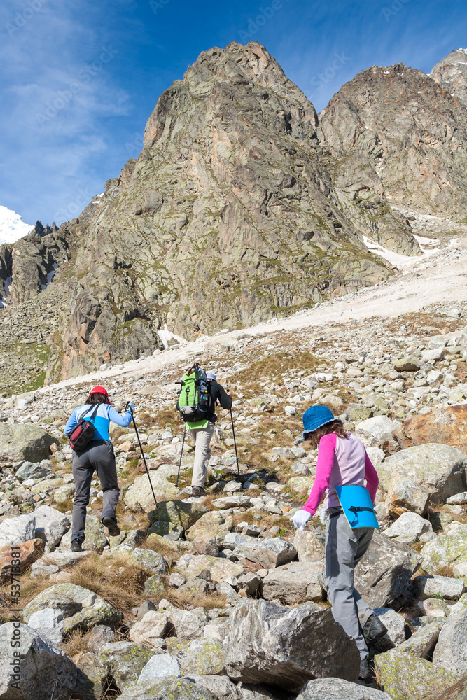 Fototapeta premium Hikier is climbing mountain in Caucasus mountains in Bezengi reg