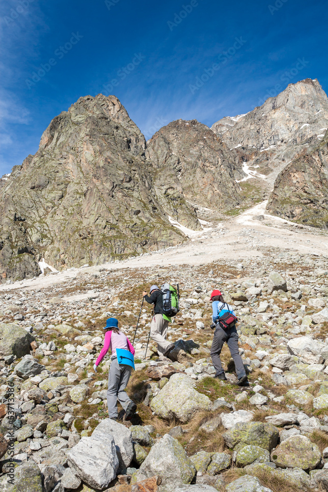 Fototapeta premium Hikier is climbing mountain in Caucasus mountains in Bezengi reg