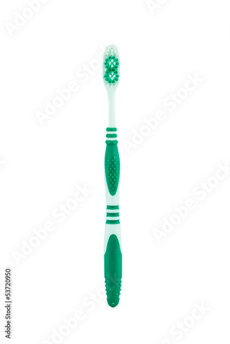 Green toothbrush on a white background