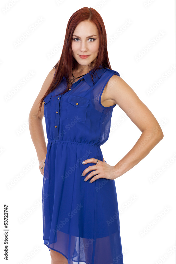 Confident young woman stands with her hands on her hips. Confident young woman stands with her hands on her hips.