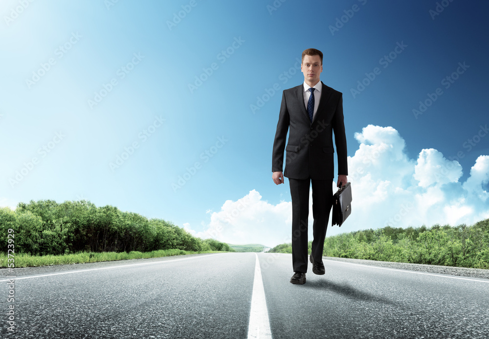 business man walking on the road business man walking on the road