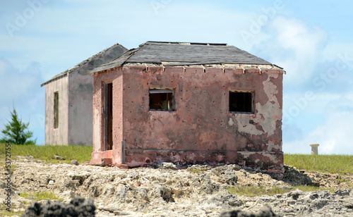 Old abandoned houses near great isaac cay lighthouse in the baha photo