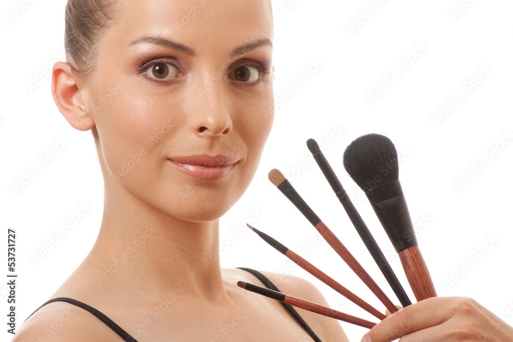 woman showing her makeup brushes, isolated on white background woman showing her makeup brushes, isolated on white background