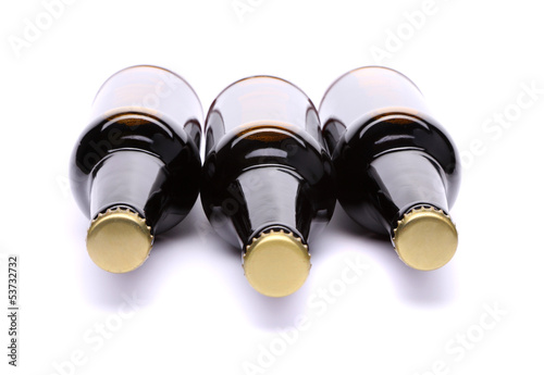 Three plugs on bottles of beer photo