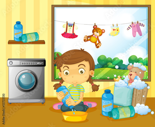 A girl washing her stuffed toys