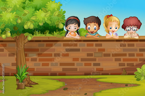 Children looking down the wall