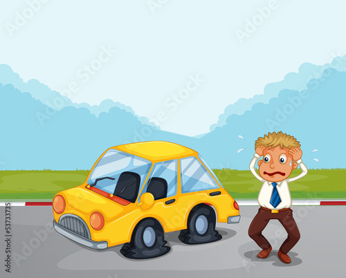 A worried gentleman beside his car with flat tires