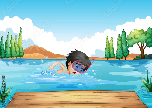 A boy swimming in the river with a pink goggle