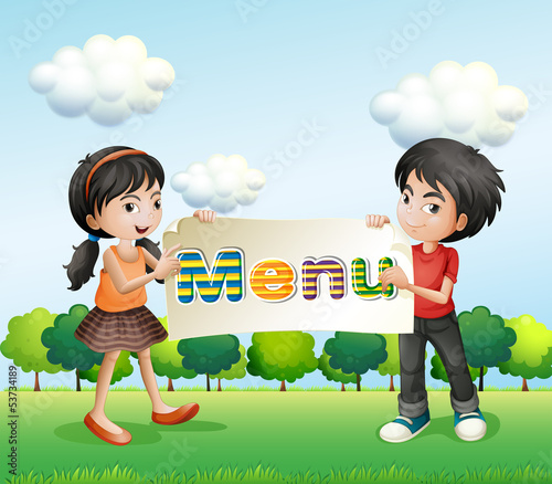 A girl and a boy holding a signboard
