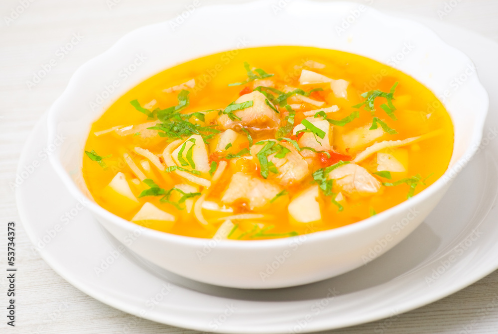 Fish soup with vegetables and pasta