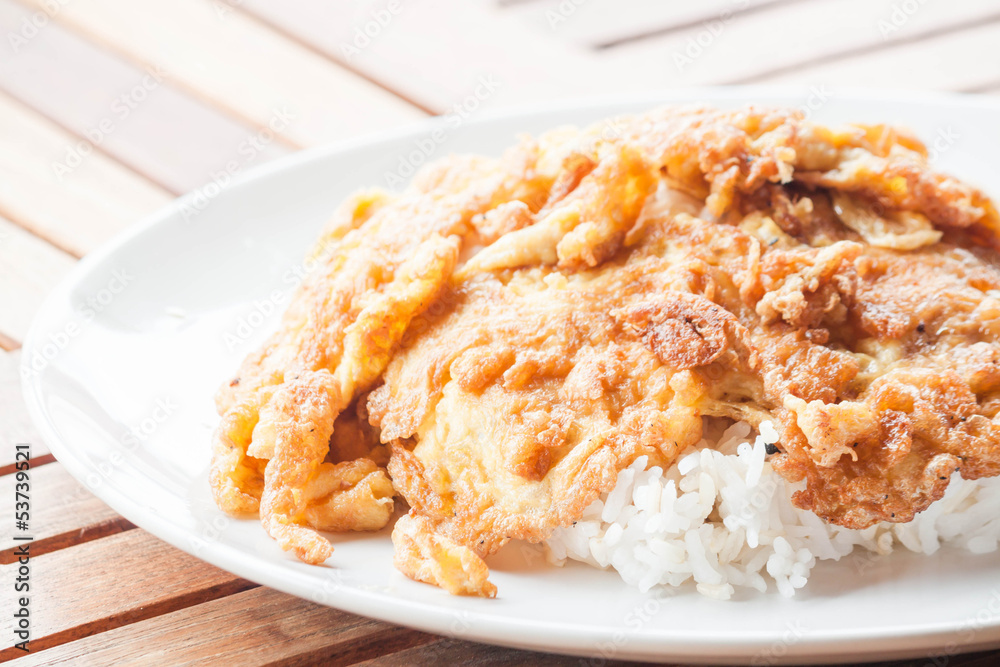 Classical plain egg omelet topped on rice Classical plain egg omelet topped on rice