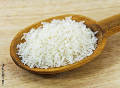 Jasmine rice on wooden spoon