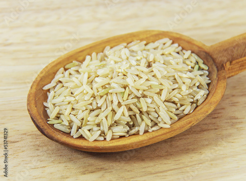 Brown Rice on wooden spoon