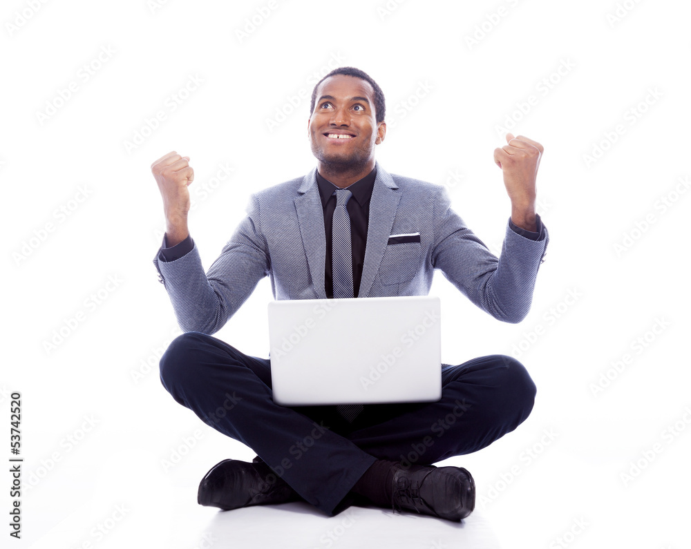 Successful business man with laptop and raised arms - isolated o Successful business man with laptop and raised arms - isolated o