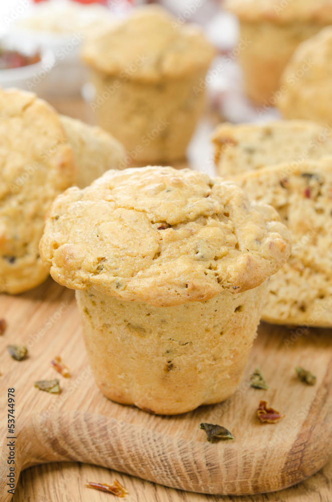 snack muffins with dried peppers and onions on wooden board snack muffins with dried peppers and onions on wooden board