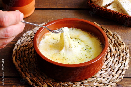 Melted provolone cheese with oregano photo