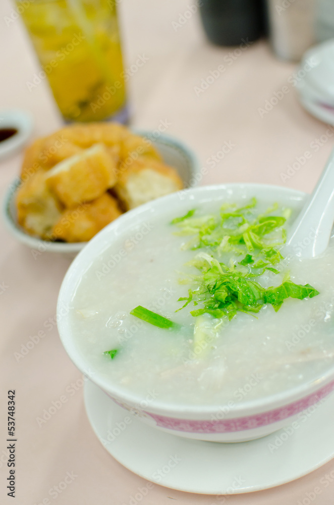 Pork Congee soup with deep fried breads to eat Pork Congee soup with deep fried breads to eat