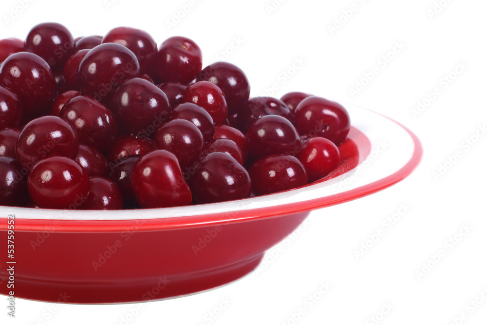 ripe cherries in a bowl isolated on a white background. close-up ripe cherries in a bowl isolated on a white background. close-up